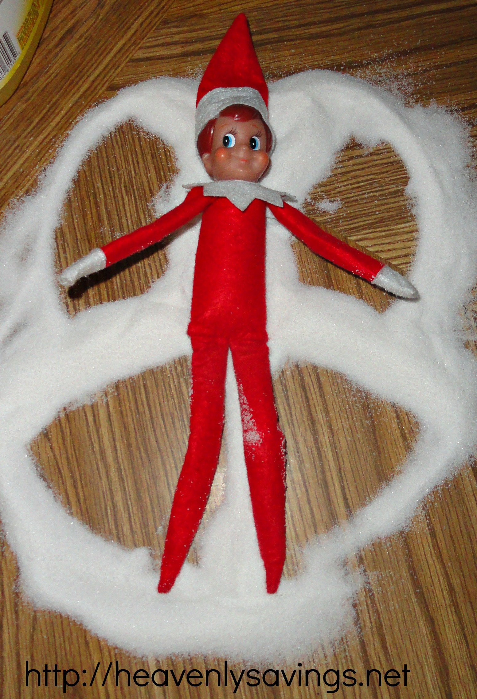 elf making snow angel